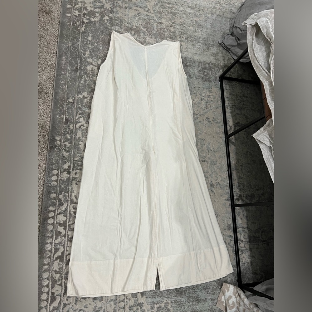 Free People cream jumpsuit. New with tags, size small.